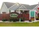 Community entrance featuring attractive brick signage and lush landscaping at 157 Blue Jacket Dr., Galivants Ferry, SC 29544