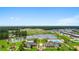 Aerial view of the community amenities featuring swimming pools, ponds, a playground and clubhouse surrounded by lush greenery at 3681 White Wing Circle, Myrtle Beach, SC 29579