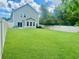 Expansive backyard featuring lush green grass and a privacy fence, great for outdoor activities at 3681 White Wing Circle, Myrtle Beach, SC 29579