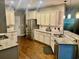 Bright kitchen featuring granite countertops, modern stainless steel appliances, and ample cabinet space at 3681 White Wing Circle, Myrtle Beach, SC 29579