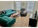 Comfortable living room featuring a modern sofa, accent chairs, and carpet flooring at 3681 White Wing Circle, Myrtle Beach, SC 29579