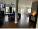Spacious living area featuring hardwood floors, a fireplace, and an open layout perfect for entertaining at 3681 White Wing Circle, Myrtle Beach, SC 29579