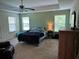 Spacious main bedroom offering plenty of natural light, a tray ceiling, and a serene ambiance at 3681 White Wing Circle, Myrtle Beach, SC 29579