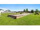 Enjoy the outdoor recreational area with bocce ball court and picnic tables surrounded by green grass and trees at 3681 White Wing Circle, Myrtle Beach, SC 29579