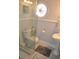 Bathroom with pedestal sink, shower, and window at 5632 Main St., Loris, SC 29569