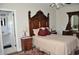 Elegant bedroom with antique wood furniture and en-suite bathroom access at 5632 Main St., Loris, SC 29569