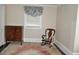 Small bedroom with a rocking chair and antique dresser at 5632 Main St., Loris, SC 29569