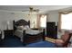 Bedroom with dark wood furniture and blue carpet at 5632 Main St., Loris, SC 29569