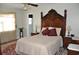 Bedroom with antique headboard, nightstands, and rug at 5632 Main St., Loris, SC 29569