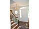 Entryway with staircase, chandelier, and rug at 5632 Main St., Loris, SC 29569