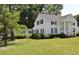 White house with black shutters, columns, and a large front yard at 5632 Main St., Loris, SC 29569