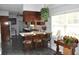 Kitchen breakfast bar with three chairs and view into kitchen at 5632 Main St., Loris, SC 29569