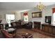 Spacious living room with leather furniture and a brick fireplace at 5632 Main St., Loris, SC 29569