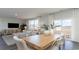 Bright dining area with wood table and chairs, adjacent to living room and kitchen at 129 Pampa Dr., Loris, SC 29569