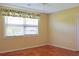 Bright bedroom with a window and hardwood floors at 530 Swallow Ave. # 530, Myrtle Beach, SC 29577