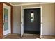 An open garage with neutral walls, a small mirror, and a beige rug outside the entryway at 530 Swallow Ave. # 530, Myrtle Beach, SC 29577