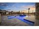 Modern pool and spa with water feature, at sunset at 129 Serenity Point Dr., Little River, SC 29566