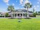Community clubhouse featuring classic architectural details, manicured landscaping and mature palm trees at 1531 Biltmore Dr., Myrtle Beach, SC 29579