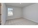 Simple bedroom with carpeted floors and a large window at 308 Happy Valley Dr., Myrtle Beach, SC 29588