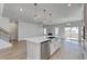 Open kitchen with island, stainless steel appliances, and white cabinetry at 308 Happy Valley Dr., Myrtle Beach, SC 29588