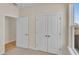 Bright bedroom with double doors leading to a spacious closet and additional room at 622 Castle Ct., Myrtle Beach, SC 29579