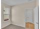 Well-lit bedroom with carpet and access to another room at 622 Castle Ct., Myrtle Beach, SC 29579