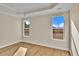 Bright bedroom with neutral walls and large windows at 622 Castle Ct., Myrtle Beach, SC 29579