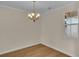 Empty dining room with chandelier, hardwood floors, and neutral walls at 622 Castle Ct., Myrtle Beach, SC 29579