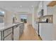 Modern kitchen with gray island, white cabinets, and stainless steel appliances at 622 Castle Ct., Myrtle Beach, SC 29579