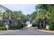 Residential community entrance with palm trees and brick columns at Tbb 129 Charles Towne Ln., Murrells Inlet, SC 29576