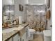 Bathroom featuring a marble countertop, an above-counter sink, and a decorative shower curtain at 202 Rivers Edge Dr., Conway, SC 29526