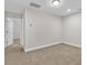 Bedroom featuring carpeted floors, white baseboards, and a partially visible doorway at 202 Rivers Edge Dr., Conway, SC 29526