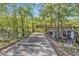 Concrete community walkway leading to a dock and waterfront, surrounded by nature at 202 Rivers Edge Dr., Conway, SC 29526