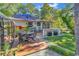 Deck with seating area, sun umbrella, and kayaks at 1202 Prince William Rd., North Myrtle Beach, SC 29582