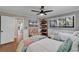 Bright bedroom with twin beds, a TV, and access to another room at 1202 Prince William Rd., North Myrtle Beach, SC 29582