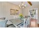 Bright dining room with a spacious table and chandelier at 1202 Prince William Rd., North Myrtle Beach, SC 29582