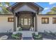 Inviting front entry with updated landscaping and modern door at 1202 Prince William Rd., North Myrtle Beach, SC 29582