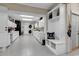 Bright laundry room with white cabinets and a convenient bench at 1202 Prince William Rd., North Myrtle Beach, SC 29582