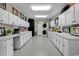 Large laundry room with white cabinets, a washer, and dryer at 1202 Prince William Rd., North Myrtle Beach, SC 29582