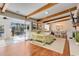 Open floor plan living room with wood floors and access to sunroom at 1202 Prince William Rd., North Myrtle Beach, SC 29582