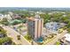 High-rise building, pool, parking lot, near ocean and other buildings at 7509 N Ocean Blvd. # 104, Myrtle Beach, SC 29572