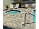 Community hot tub and patio seating area at 7509 N Ocean Blvd. # 104, Myrtle Beach, SC 29572