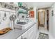 Full view of kitchen, farmhouse style, white cabinets, vintage sink at 7509 N Ocean Blvd. # 104, Myrtle Beach, SC 29572