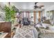 Bright living room, coastal decor, comfy seating, fireplace, access to balcony at 7509 N Ocean Blvd. # 104, Myrtle Beach, SC 29572