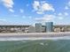 Beautiful beach view with resorts on a sunny day at 201 S Ocean Blvd. # 1005, Myrtle Beach, SC 29577