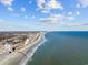 Stunning aerial view of the coastline, buildings, and ocean at 201 S Ocean Blvd. # 1005, Myrtle Beach, SC 29577