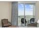 Relaxing sitting area and balcony with ocean view and natural light at 201 S Ocean Blvd. # 1005, Myrtle Beach, SC 29577
