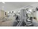 A fully-equipped fitness center with cardio machines, weights, and ample natural light at 201 S Ocean Blvd. # 1005, Myrtle Beach, SC 29577