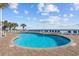 A beautifully-maintained community pool provides amazing ocean views and plenty of lounge chairs at 201 S Ocean Blvd. # 1005, Myrtle Beach, SC 29577