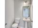 Bathroom featuring a pedestal sink, toilet, and a decorative mirror at 126 Hancher Dr., Myrtle Beach, SC 29588